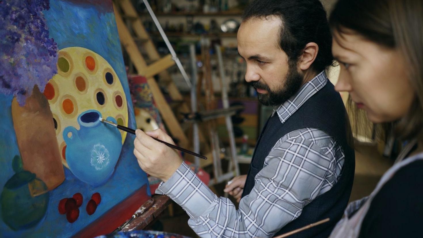 Artist working on canvas